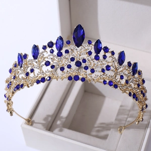 Close-up of rose gold bridal crown with navy blue marquise stones and sparkling crystals