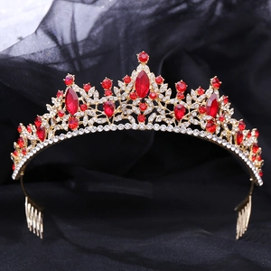 Detail shot of golden bridal crown featuring elegant red leaf-shaped rhinestones and side combs
