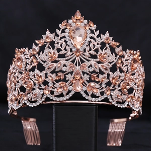 Close-up of champagne crystal baroque crown with rose gold metal and pear-shaped gems