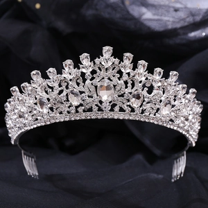 Detailed view of silver bridal tiara featuring sparkling crystals and side hair combs
