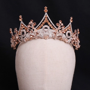 Close-up of rose gold crystal bridal tiara featuring intricate floral and tower design