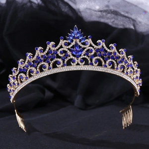 Close-up of golden alloy bridal crown featuring navy blue rhinestones and micro-pave crystals