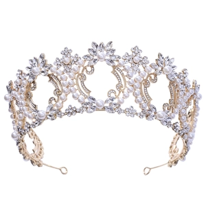 Detailed close-up of a Baroque gold bridal crown with white pearls and sparkling crystals