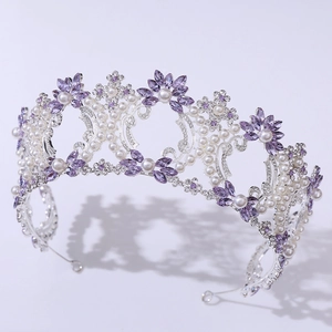 Detail of Baroque bridal crown featuring purple crystals and white pearls on silver band