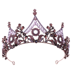Detailed macro shot of vintage Baroque tiara with purple gemstones and leaves