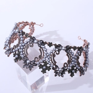 Detailed view of rose gold baroque bridal crown with dark grey pearls and crystals