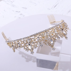 Elegant gold bridal leaf crown with sparkling rhinestones on a clear display stand