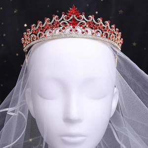 Golden Baroque bridal crown with red rhinestones and crystals on a white bridal veil