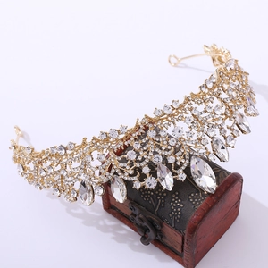 Detailed macro view of luxury rose gold bridal tiara with rhinestones on vintage box