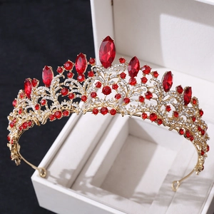 Detailed 45-degree angle of rose gold bridal crown with red crystals and white rhinestones