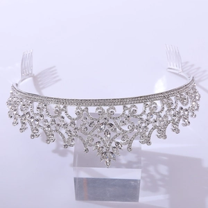 Detailed macro view of a silver bridal crown featuring intricate crystal floral patterns