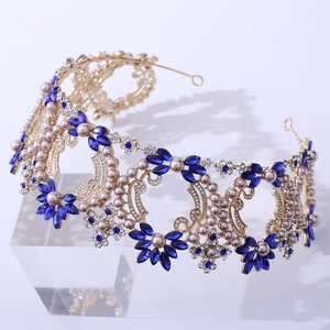 Detailed macro view of luxury baroque bridal crown with blue crystals and pearls