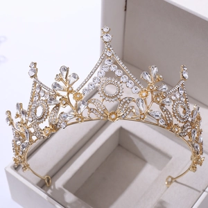 Macro view of luxurious floral baroque gold bridal tiara with sparkling crystal details