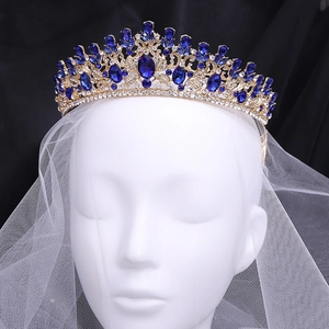 Baroque gold leaf bridal crown with deep blue crystals and small white diamonds for weddings