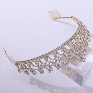 Detailed top view of gold bridal tiara with sparkling rhinestones and hair combs