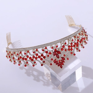 Detail of red crystal clusters on gold baroque tiara with secure side hair combs