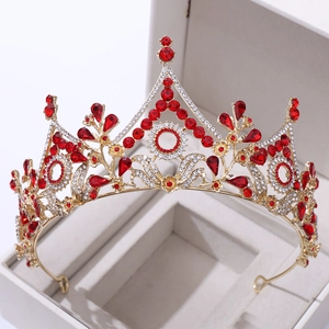 Detailed macro view of the luxury gold crown with red crystals and white rhinestones