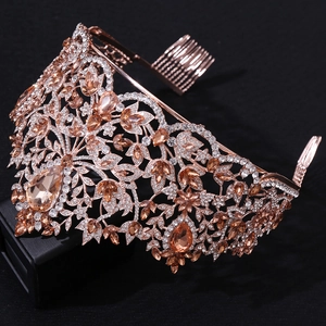 Close-up of champagne crystal baroque crown with rose gold floral filigree details