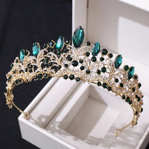 Luxury rose gold bridal crown featuring emerald crystals and white rhinestones