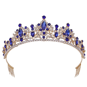 Elegant gold bridal tiara with deep blue gemstones and sparkling rhinestones for weddings