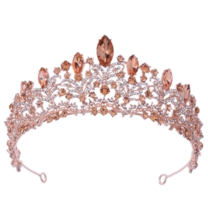 Detail of rose gold bridal tiara featuring champagne marquise stones and sparkling crystals