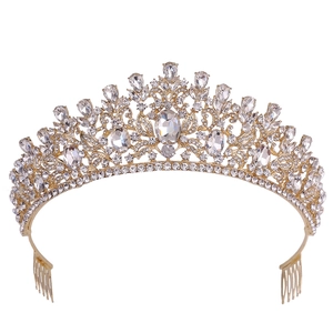 Macro detail of golden bridal crown showing clear crystals and side combs