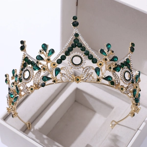 Baroque bridal crown with green crystals and white diamonds on a gold alloy frame
