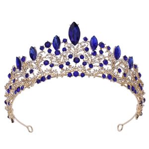 Luxurious rose gold bridal crown with deep blue crystals and rhinestones for weddings
