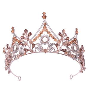 Macro shot of rose gold bridal crown with champagne crystals and floral baroque details
