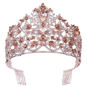 Detail of rose gold Baroque crown featuring champagne crystals and floral vine structure