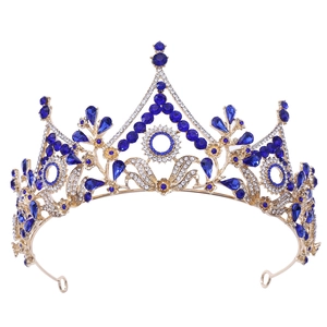 Luxury Baroque bridal crown with blue gemstones and sparkling crystals in gold finish