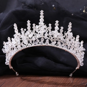 Macro detail of silver bridal crown featuring intricate crystal beads and sparkling rhinestones