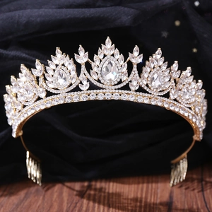 Detailed macro view of a gold bridal crown with crystals and integrated hair combs