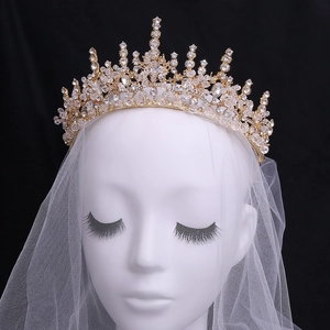 Baroque bridal crown with gold alloy and crystals on mannequin with black background