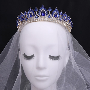 Gold Baroque bridal crown with blue crystals and white rhinestones on mesh veil