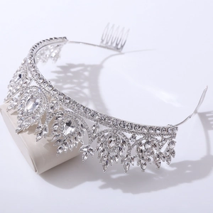Macro detail of bridal crown with silver crystals, leaf motifs and secure hair combs