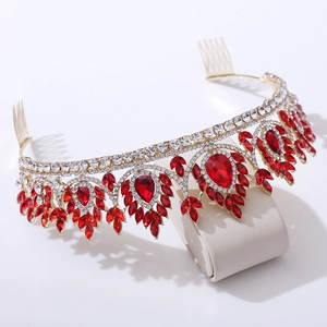 Detailed side view of Baroque bridal crown with red crystals and gold comb attachment