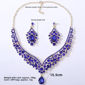 Detail view of blue crystal teardrop necklace and earrings set with gold-plated frame