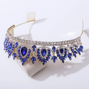 Detailed side view of golden bridal tiara with blue drop crystals and secure hair comb base