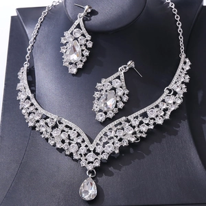 Detailed view of silver crystal bridal jewelry set with pear-cut teardrop pendants
