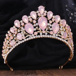 Luxurious pink crystal bridal crown with gold metal base for weddings and parties