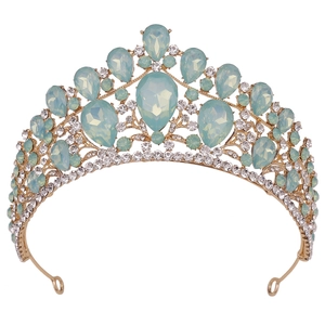Detailed view of luxury gold bridal tiara featuring large sea blue opal water droplets