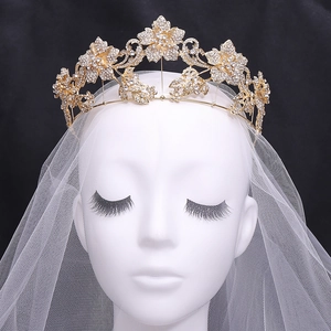 Detailed view of floral bridal tiara with rhinestones on a wedding veil model