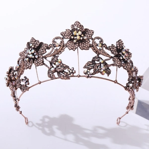 Macro detail of vintage floral tiara with bronze petals and iridescent crystals