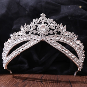 Luxury bridal crown tiara with silver metal base and clear crystal rhinestones on velvet