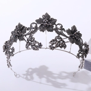 Detailed view of the dark gothic baroque crown featuring black floral rhinestone metalwork