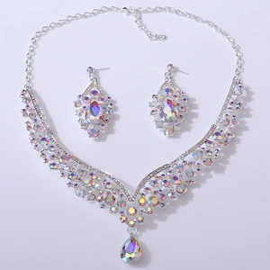 Detail view of silver bridal jewelry set with sparkling AB crystals and drop pendant