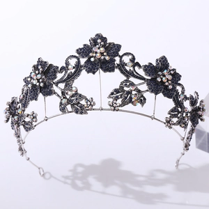 Detailed macro view of baroque purple floral crown with rhinestone and antique metal finish
