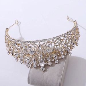 Close-up of golden bridal tiara with sparkling crystal rhinestones and classical design