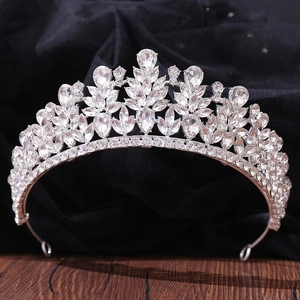 Close-up of bridal crown featuring leaf motifs with teardrop and marquise cut rhinestones